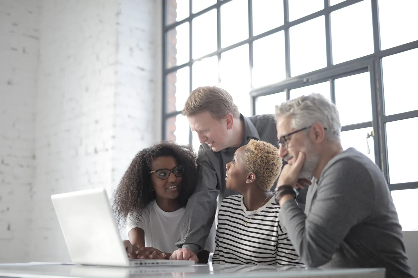 Illustrative stock photograph of colleagues discussing a project